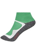 A short sports sock featuring a green and white design with a grey sole. Includes a logo on the side.