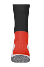 A pair of sport socks featuring black, red, and white colours, with a padded grey area on the sole.