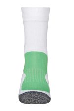 A pair of sporty socks in white with a green section and grey detailing, featuring a logo.
