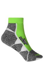 A pair of sporty ankle socks in grey and bright green, featuring a logo and a unique design.