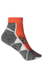 Sport sneaker socks featuring grey and orange colours with a branded logo. Designed for comfort and style.
