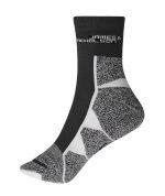 Sport socks in grey and black with a textured design and a logo at the top.