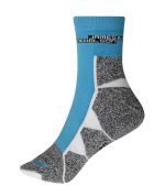 Sport socks in light blue and grey with a patterned design and a logo at the top. Suitable for sports uniforms.