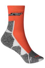 Sport socks in orange and grey with a patterned design and a logo at the top.