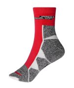A pair of red and grey sports socks with a logo on the cuff. The design features a mix of textures and patterns.