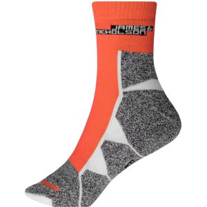 A pair of sports socks featuring an orange upper and grey patterned lower section, with a logo on the cuff.