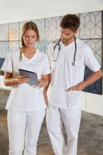 A white tunic-style uniform worn by a woman and a man, with the man holding a stethoscope.