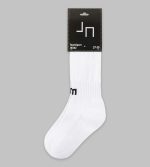 A pair of white sports socks with a branding tag attached at the top.