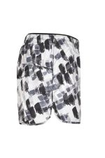 A pair of ladies' sports shorts featuring a black and white abstract pattern, with an elastic waistband and a pocket.