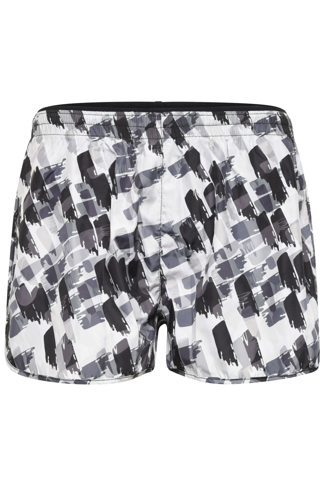 A pair of ladies sports shorts in a black and white abstract pattern, featuring an elastic waistband and a logo. A pair of ladies sports shorts in a black and white abstract pattern, featuring an elastic waistband and a logo.
