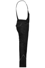 Workwear pants with bib in black, featuring adjustable suspenders and a side pocket, with contrast stitching and branding.