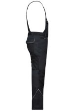 Workwear pants with bib in black, featuring adjustable suspenders and a logo on the waistband.