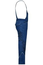Workwear pants with bib in navy blue, featuring adjustable straps and multiple pockets. Includes a logo detail.