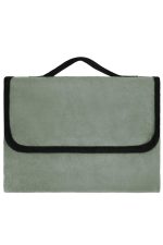 A green picnic blanket with a black edge and a handle for carrying. It has a soft, plush texture.