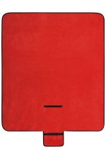 A red picnic blanket with a black border and a compact fold feature for easy storage.