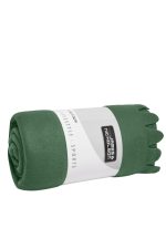A rolled green fleece blanket featuring a branded label. Soft material suitable for home use.