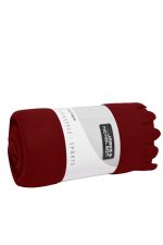 A rolled burgundy fleece blanket with a white band featuring a logo.