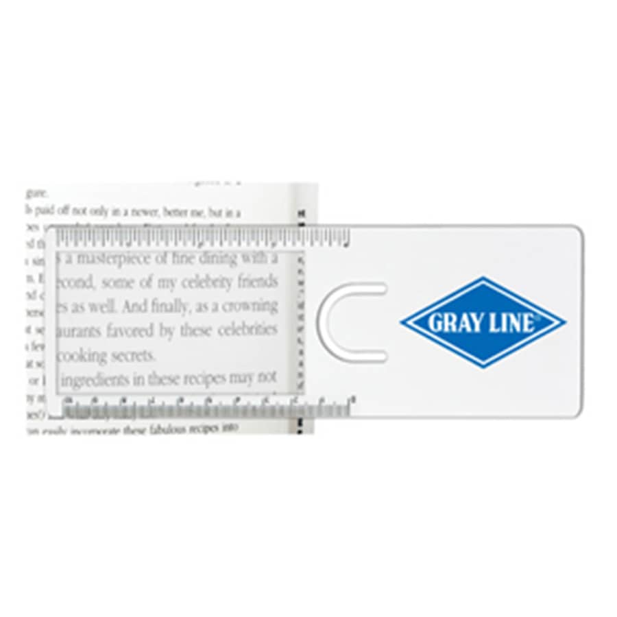 A transparent magnifier ruler with a blue logo, displaying text from a book and measurement markings. The Easy Reader Magnifier Ruler - Image 1