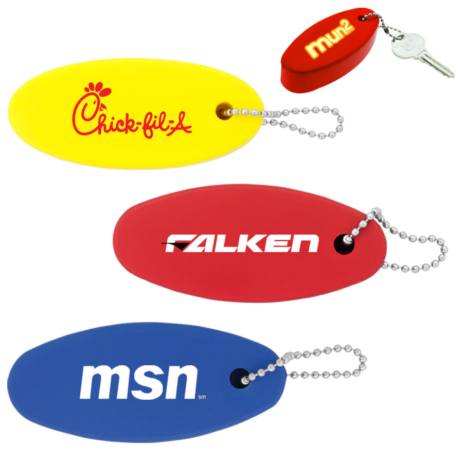 A collection of floating keychains in yellow, red, and blue, each attached to a chain, with various logos. Floating Keychain - Image 1