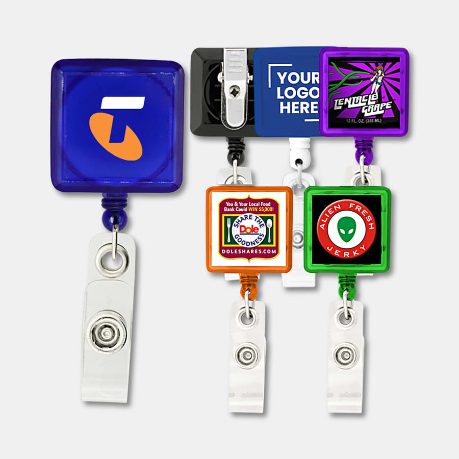 A collection of rectangle badge holders in various colours, each featuring a logo. Clear retractable strap included. Rectangle Badge Holder - Image 1