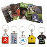 A collection of metal key rings on backing cards, featuring various designs and colours, packaged in poly bags.