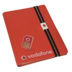 A5 bonded leather notebook in red with an elastic band and clip, featuring a logo on the cover.