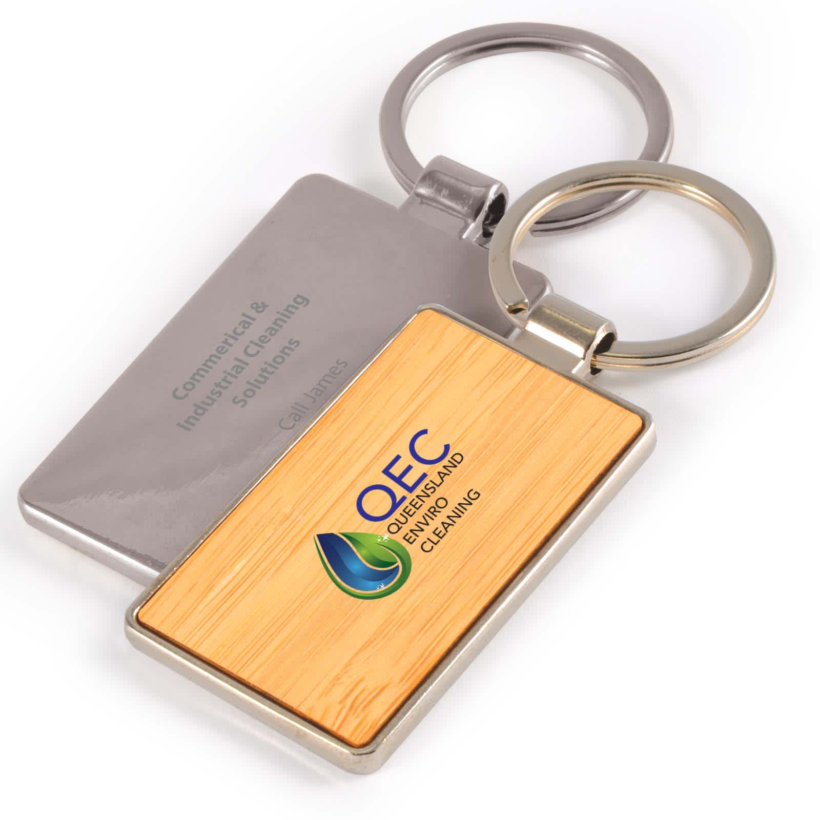 A Rectangle Bamboo Zinc Keytag featuring a bamboo design and a metal backing with a logo. Rectangle Bamboo Zinc Keytag - Image 1