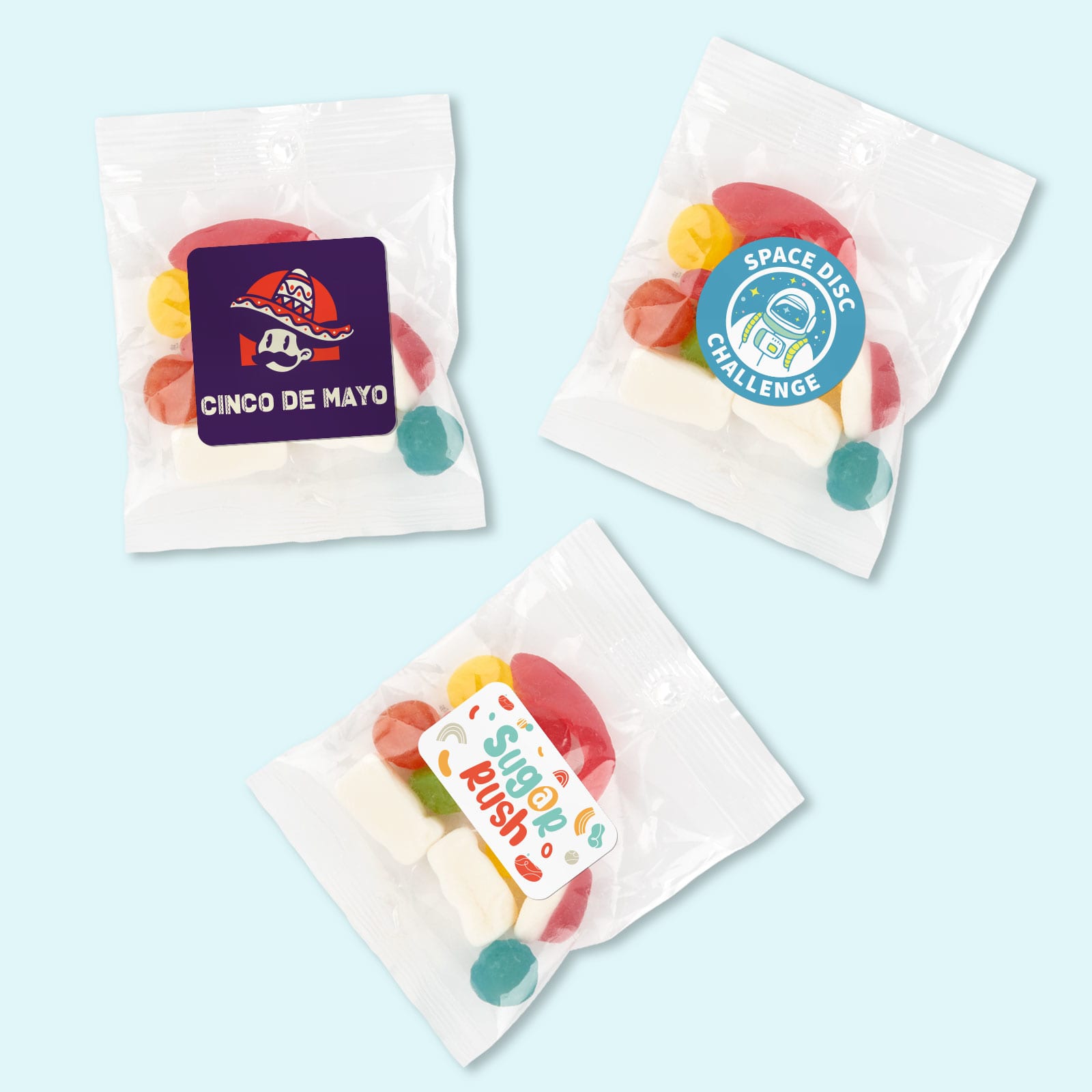 Assorted jelly candies in colorful shapes, packaged in clear cello bags with various labels. Assorted Jelly Party Mix in 50 Gram Cello Bag - Image 1