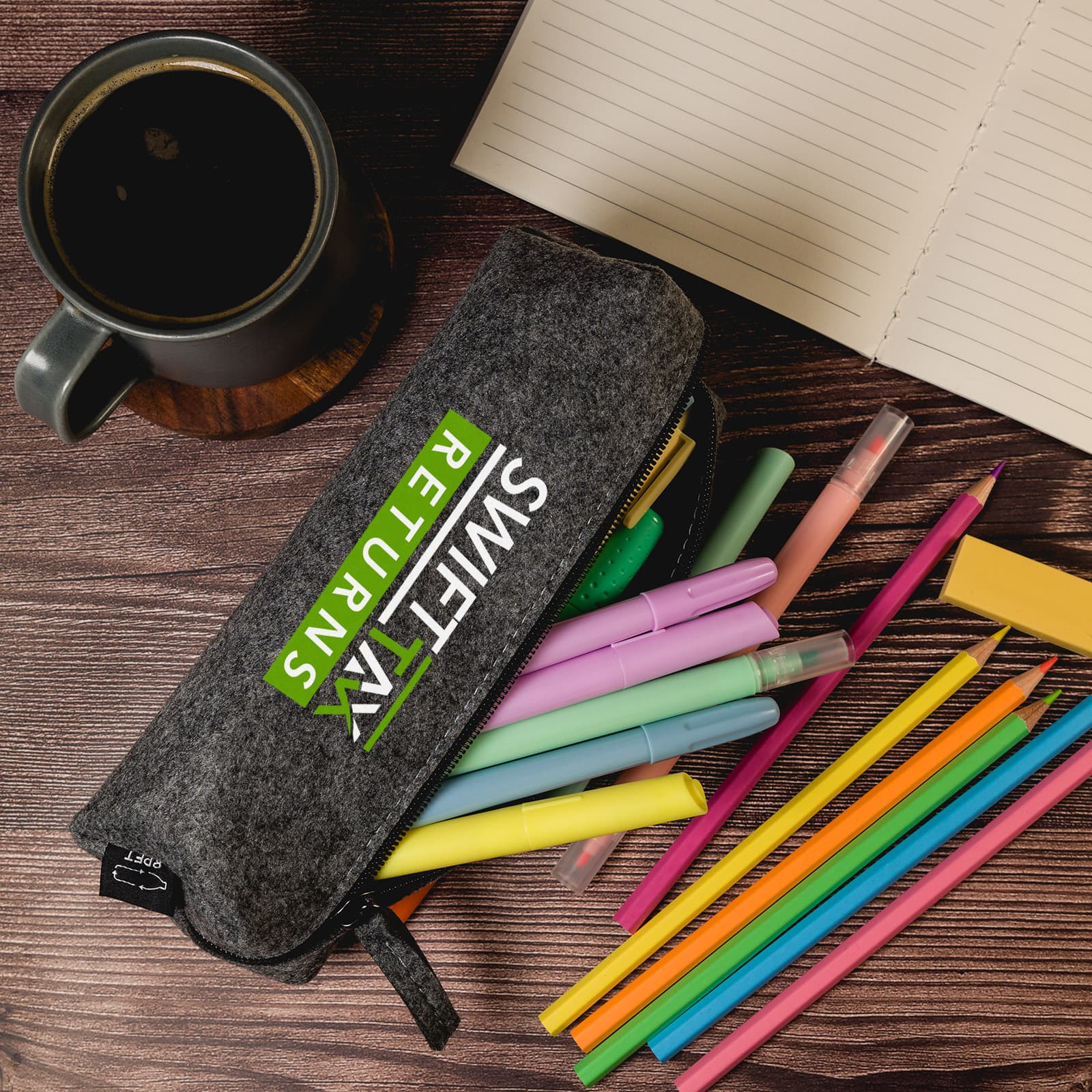 A grey felt utility case containing colorful pens and markers, alongside a mug and a notepad. Montana RPET Felt Utility Case - Image 1