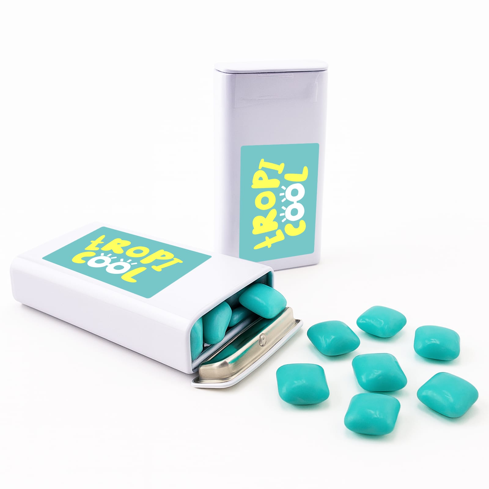 A pack of turquoise chewy mints, with some mints spilled out, in a silver tin featuring a logo. Chewy Peppermint Mints - Image 1