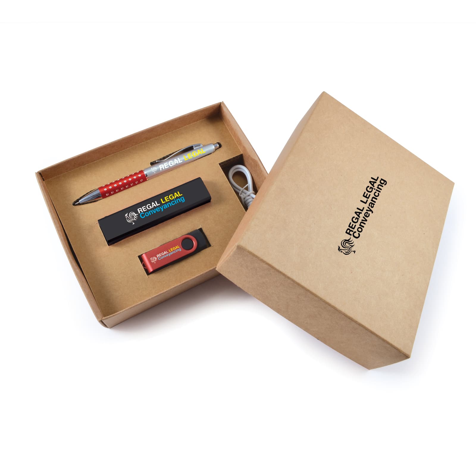 A promotional gift set in a brown cardboard box containing a pen, USB drive, and keyring. The items feature various colours. Carnival Cardboard Gift Set - Image 1