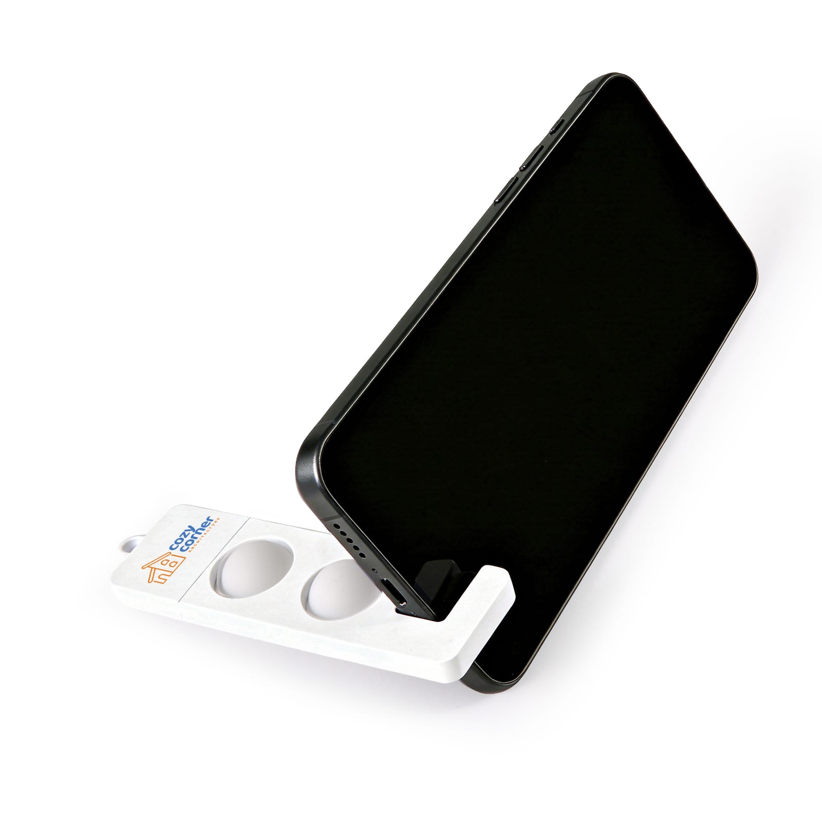 A white phone stand securely holding a black smartphone, featuring a logo on its base. Pop Phone Stand - Image 1