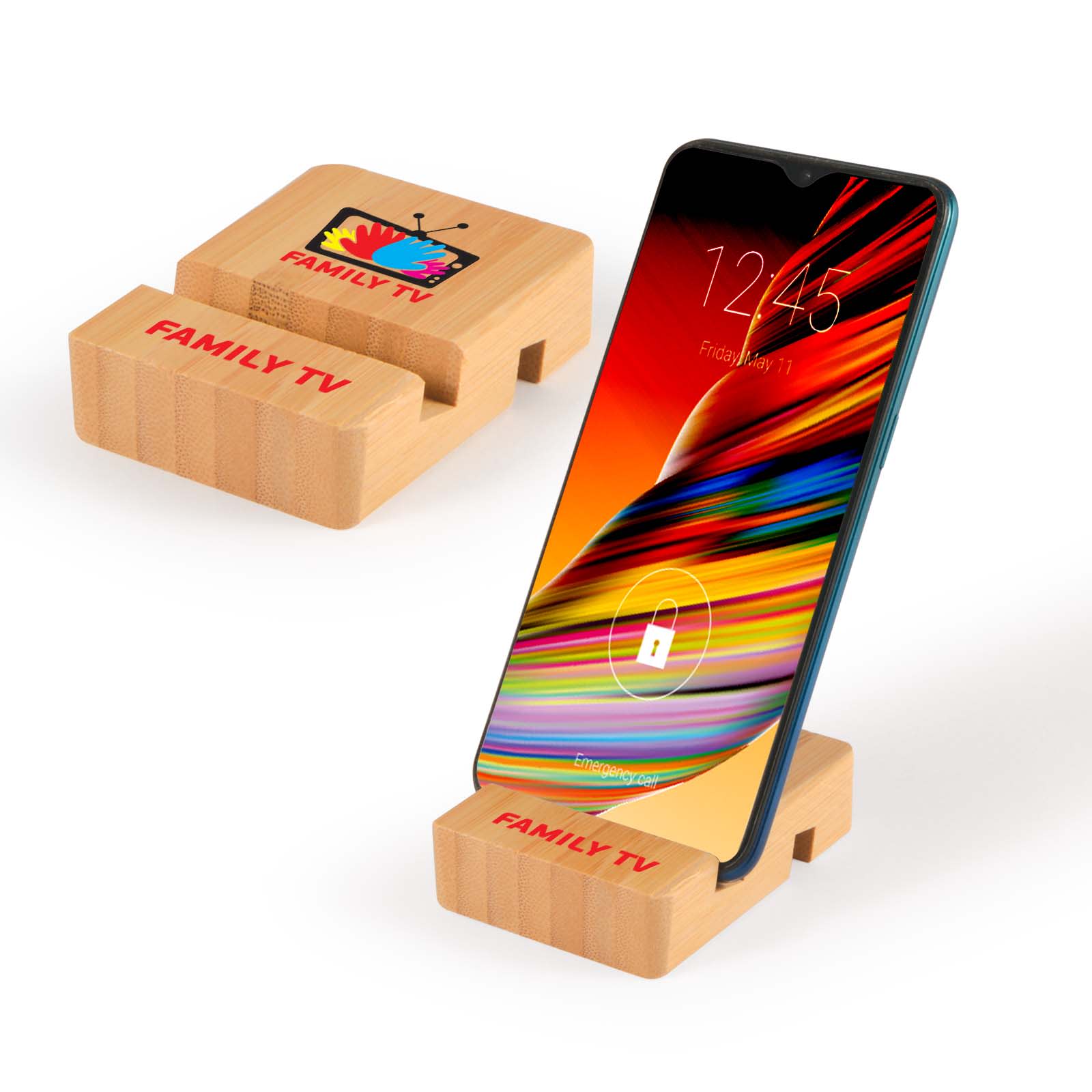 A bamboo phone stand in natural color displaying a smartphone. The stand features a logo design. Rascal Bamboo Tablet & Phone Stand - Image 1