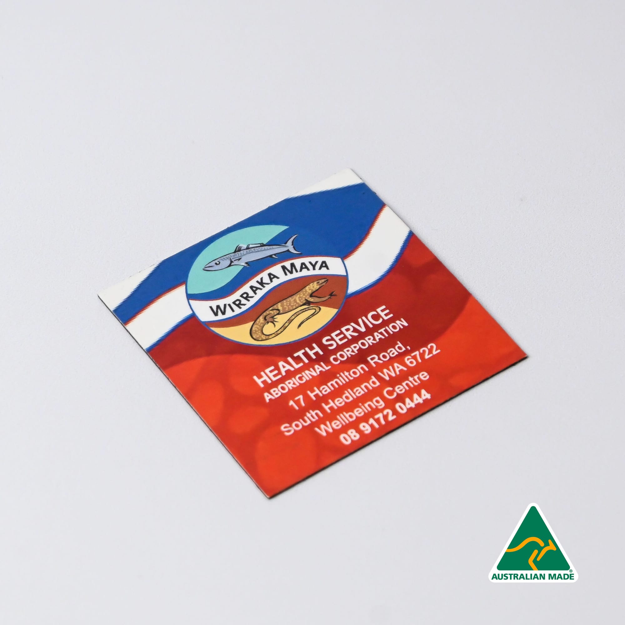 A square fridge magnet featuring a colourful design with a logo, predominantly in red, blue, and white. Fridge Magnet (50mm x 50mm) - Image 1