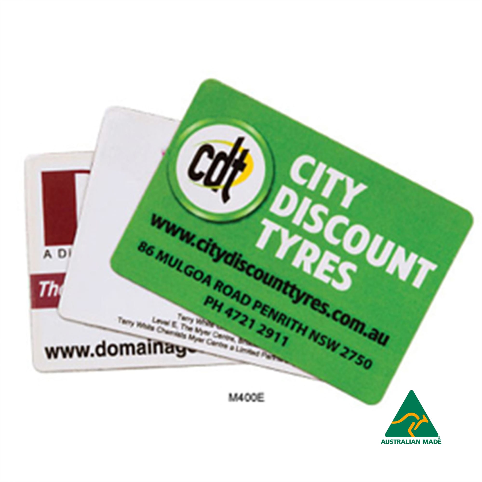 Three rounded corner fridge magnets in various colours, featuring different logos and designs, including one with a green background. Fridge Magnet (50mm x 70mm - Rounded Corners) - Image 1
