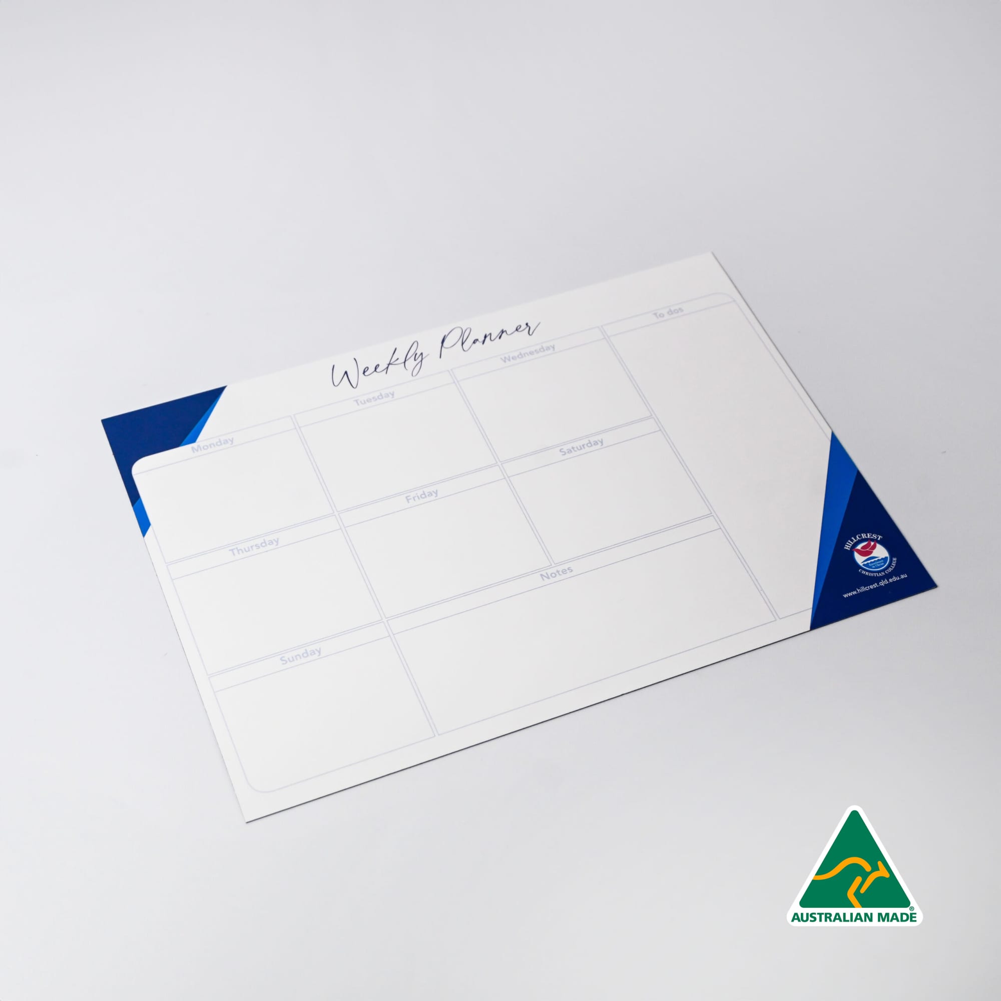 A magnetic whiteboard in white and blue, featuring a weekly planner layout with multiple sections. Magnetic Whiteboard (210mm x 297mm) - Image 1