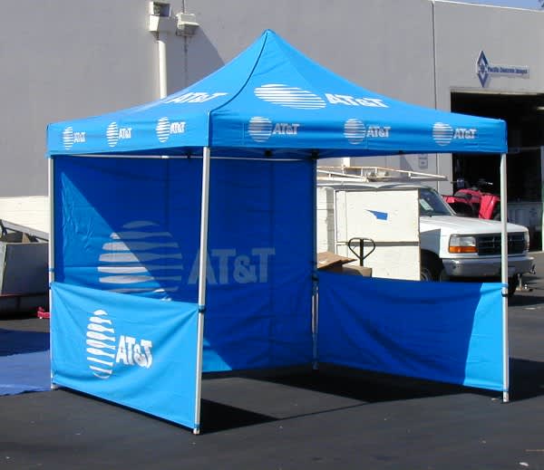 A blue promotional tent with a peaked roof and side walls, featuring a logo and branding. Marquee Walls Double Sided Printed Wall - 3000 x 2050 mm - Image 1