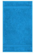 A blue guest towel featuring a textured design and horizontal striping. It also has a logo or branding.