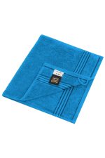A blue hand towel with a textured surface and striped design, featuring a label and a hanging loop.