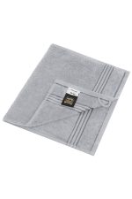 A grey guest towel with a striped design and a label, featuring a folded corner.