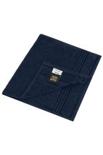 A navy hand towel featuring a textured design and a loop for hanging. The towel has a branding label.