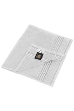 A grey guest towel with a textured border and a hanging loop, featuring a branded label.