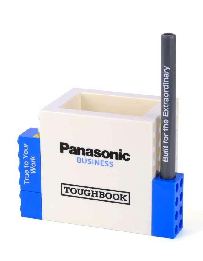 A pen pot set in white and blue featuring a logo, with a single grey pen inserted. Mini Pen Pot Set - Image 1