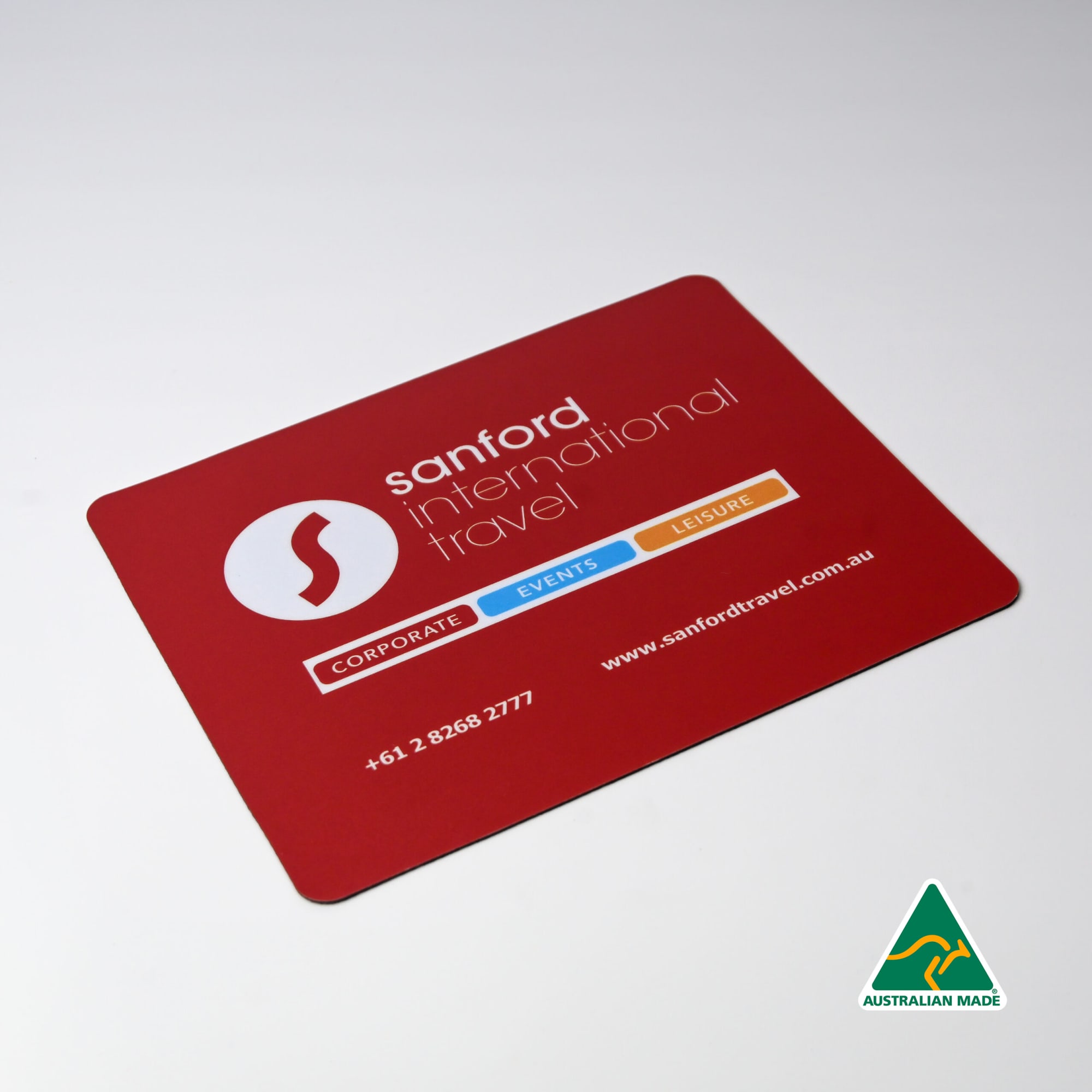 A red mouse mat featuring a logo, with contact details and categories for corporate, events, and leisure services. Optical Friendly Mouse Mat (230mm x 190mm) - Image 1