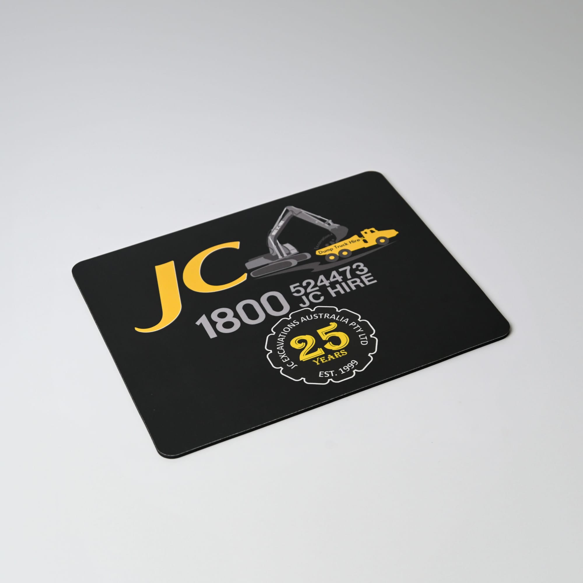 A black mouse mat featuring yellow graphics and text, including a logo and contact information. Fabric Mouse Mat (225mm x 185mm) - Image 1