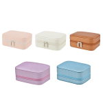 A set of five small jewellery storage boxes in pastel pink, white, tan, lavender, and light blue. Each box has a zip closure.