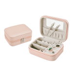 A pink jewellery box with a zip opening, featuring compartments for rings and a mirror inside.