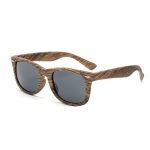Wood-like sunglasses with dark grey lenses and a textured brown frame. Features a logo on the side.