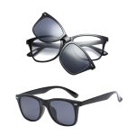 Two pairs of black sunglasses displayed, one atop the other, featuring dark lenses and a sleek design.