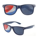 Novelty pinhole eyeglasses featuring a blue frame with red and white patterned lenses. Logo present on the design.